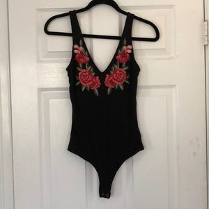 Black onesie with floral detail